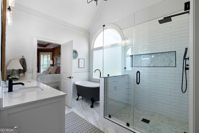 bathroom with lofted ceiling, tile walls, vanity, ornamental molding, and independent shower and bath