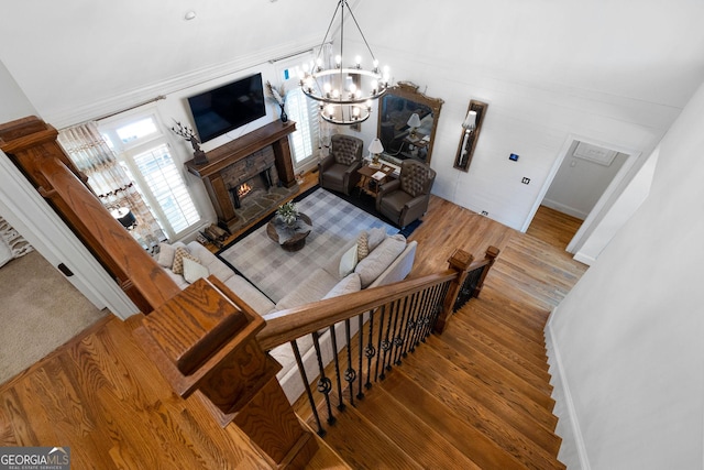 living room with an inviting chandelier and wood-type flooring