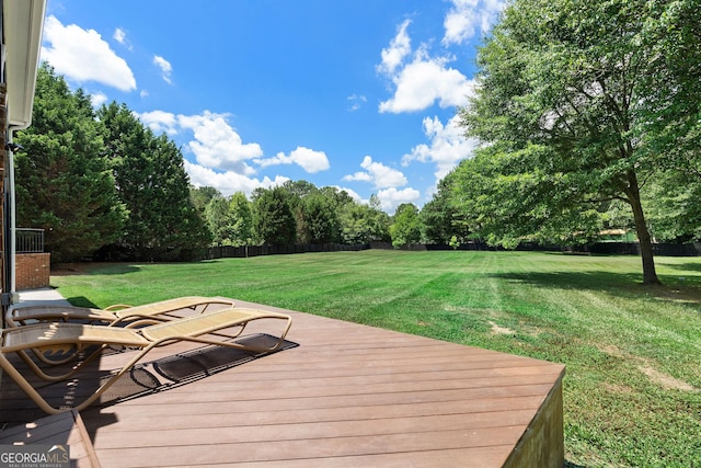 deck featuring a lawn