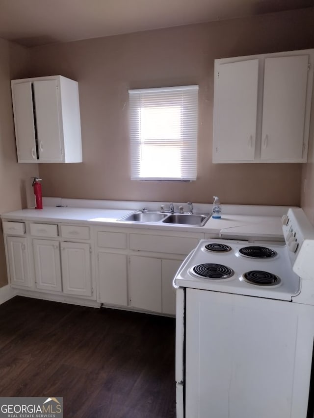 kitchen with white cabinets, white range with electric stovetop, and dark wood-type flooring