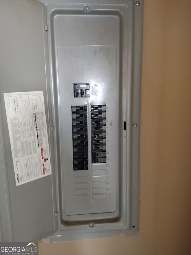 utility room featuring electric panel