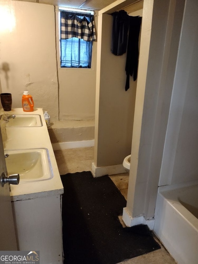 bathroom with vanity and toilet