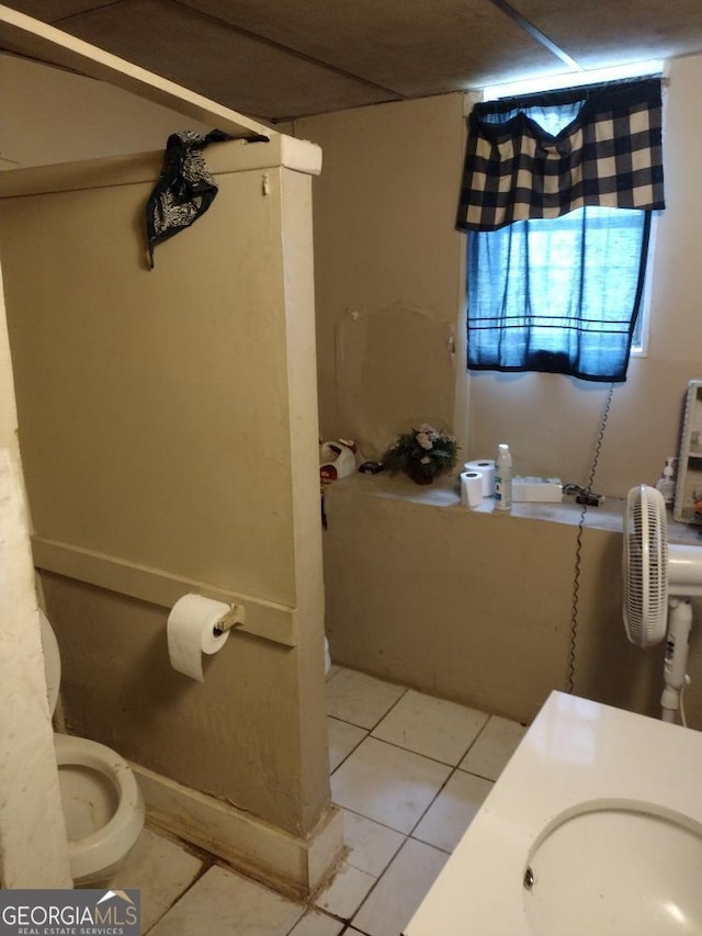 bathroom featuring tile patterned floors, toilet, and sink