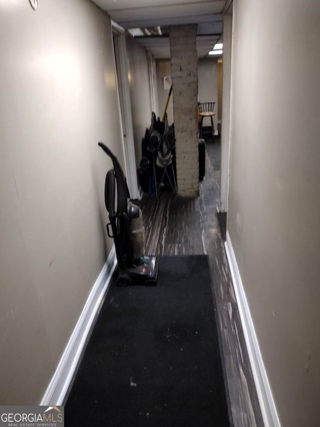 hallway featuring dark wood-type flooring