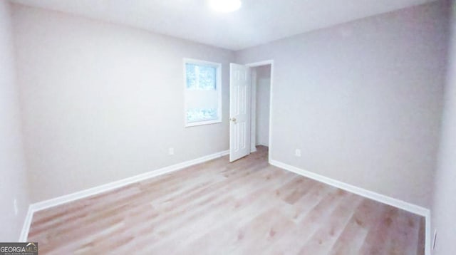 spare room featuring light hardwood / wood-style floors