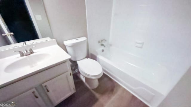 full bathroom with shower / washtub combination, hardwood / wood-style floors, vanity, and toilet