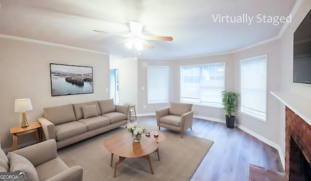 living room with ceiling fan, ornamental molding, and wood-type flooring