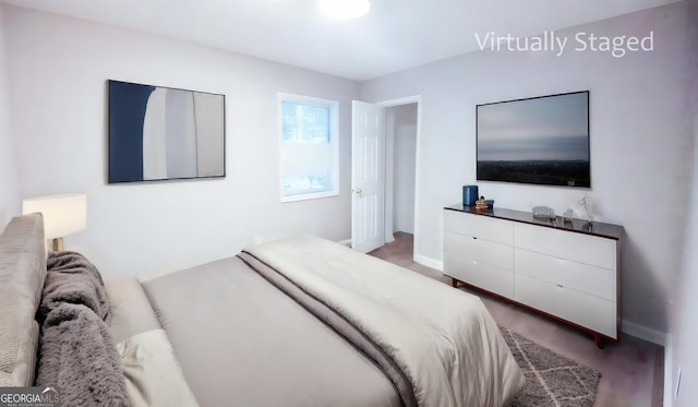 bedroom with hardwood / wood-style flooring