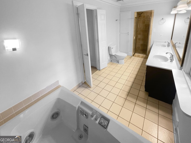 bathroom with a washtub, tile patterned floors, toilet, vanity, and ornamental molding