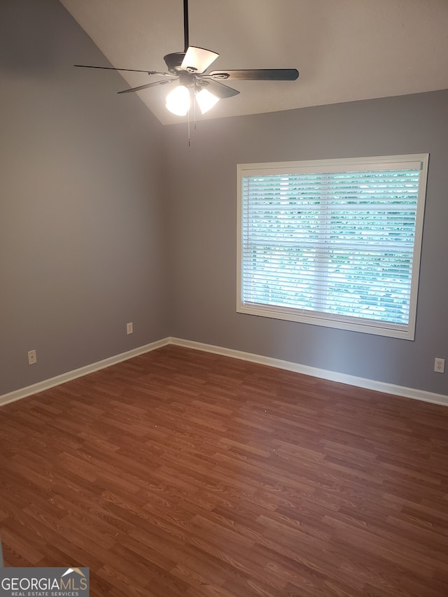 spare room with ceiling fan and dark hardwood / wood-style floors