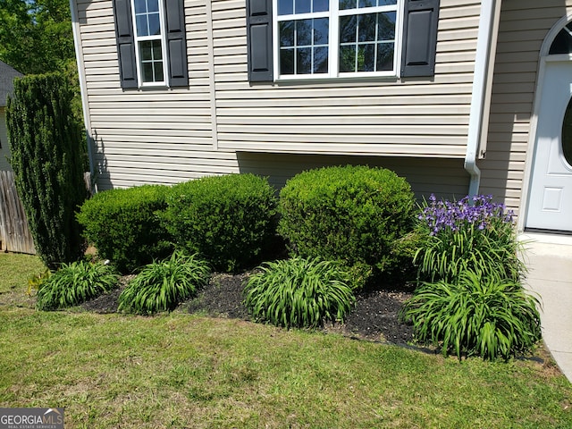 view of home's exterior featuring a lawn