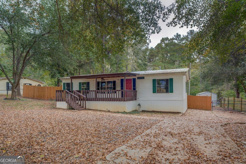 view of front of property featuring a wooden deck