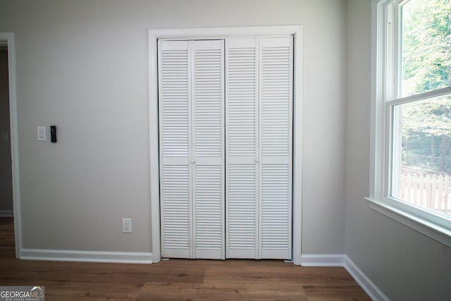 bathroom featuring hardwood / wood-style floors, vanity, and toilet