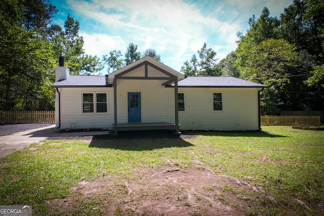 view of home's exterior with a yard