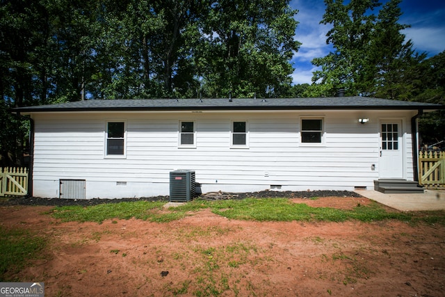 back of house with cooling unit