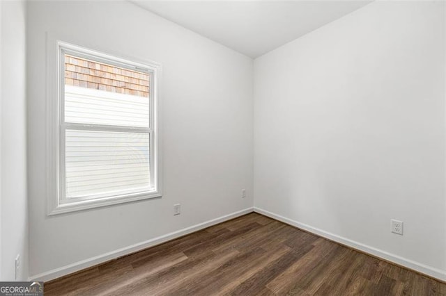 unfurnished room featuring dark hardwood / wood-style floors