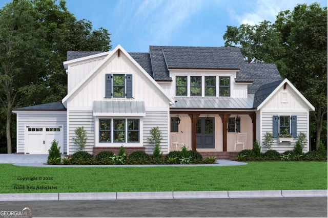 view of front of house with a garage, a front yard, and a porch