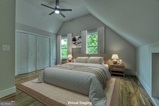 bedroom featuring ceiling fan, hardwood / wood-style flooring, vaulted ceiling, and a closet