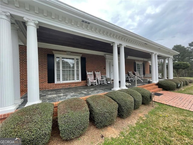 back of property with a porch