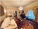 living room with an inviting chandelier