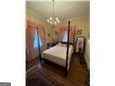 bedroom featuring a chandelier