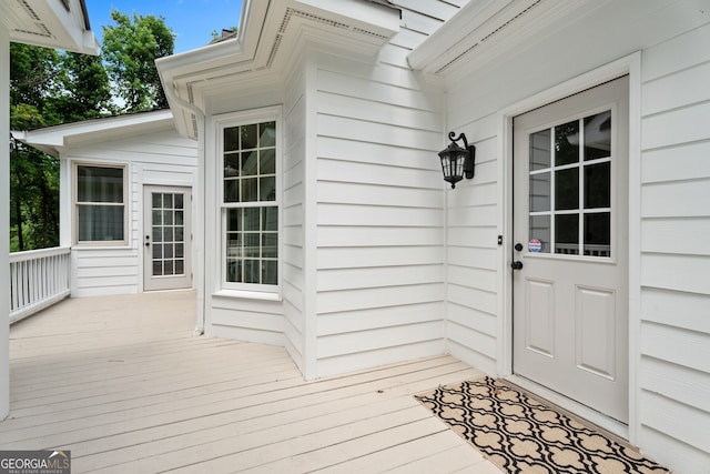 view of exterior entry featuring a deck