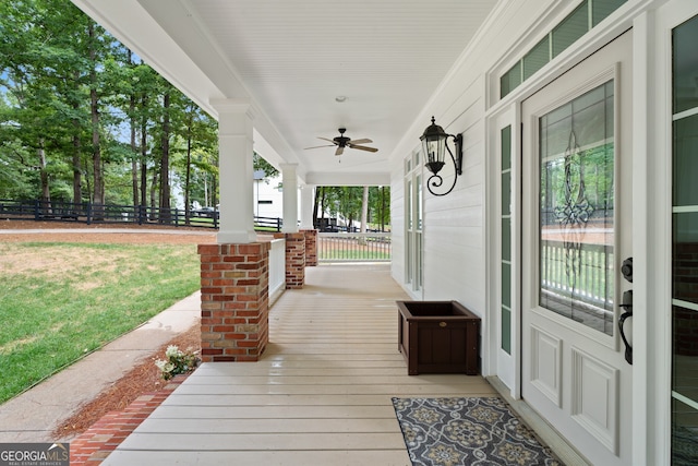 exterior space with ceiling fan