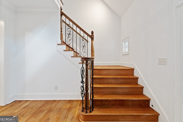 stairway with wood-type flooring