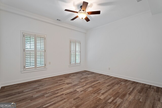 spare room with dark hardwood / wood-style floors, a healthy amount of sunlight, and ceiling fan