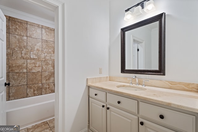 bathroom featuring bathing tub / shower combination, vanity, ornamental molding, and tile patterned floors