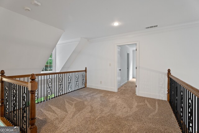 interior space with carpet flooring and vaulted ceiling