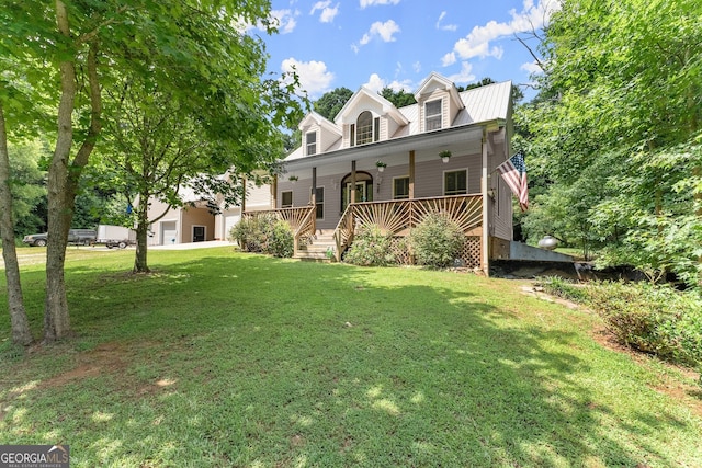 view of front facade featuring a deck and a front yard