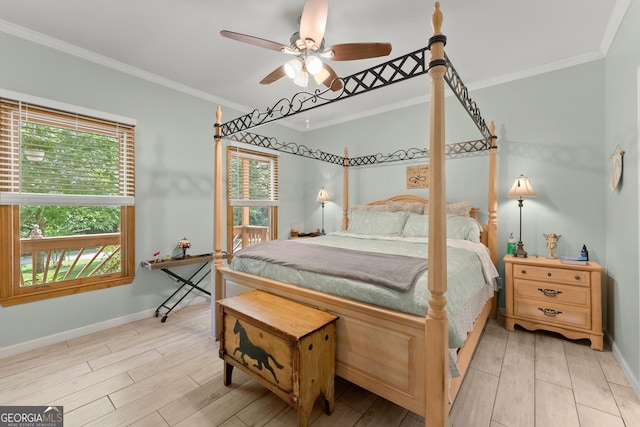 bedroom with light wood-type flooring, ceiling fan, and crown molding