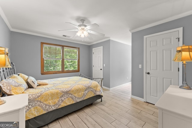 bedroom with ceiling fan, light hardwood / wood-style floors, and crown molding