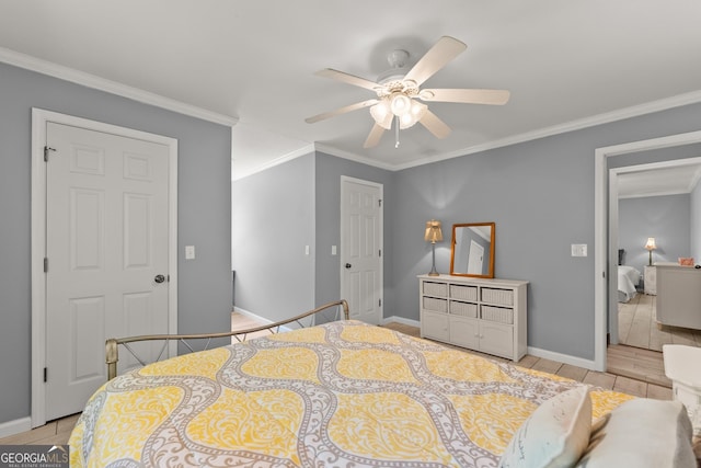 tiled bedroom featuring ceiling fan and crown molding