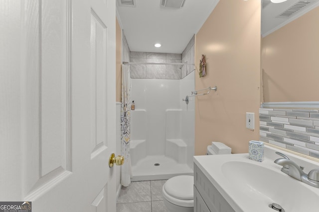 bathroom with toilet, walk in shower, decorative backsplash, tile patterned floors, and vanity