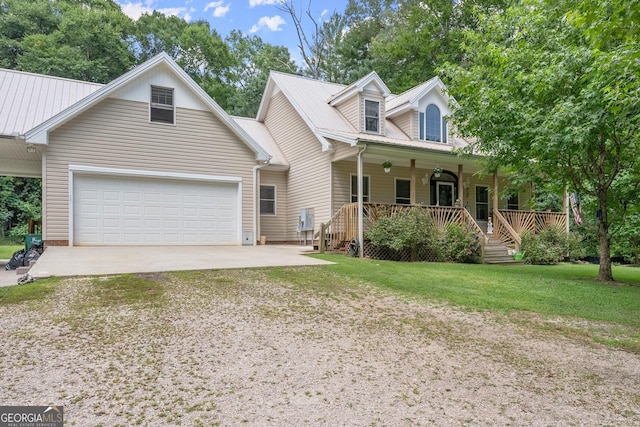 view of front of home with a porch, a garage, and a front lawn