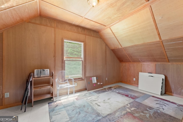 additional living space featuring wooden walls, lofted ceiling, and wood ceiling