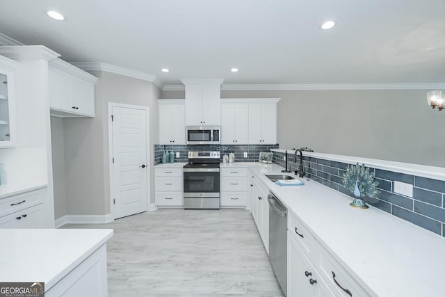 kitchen with white cabinets, sink, and stainless steel appliances