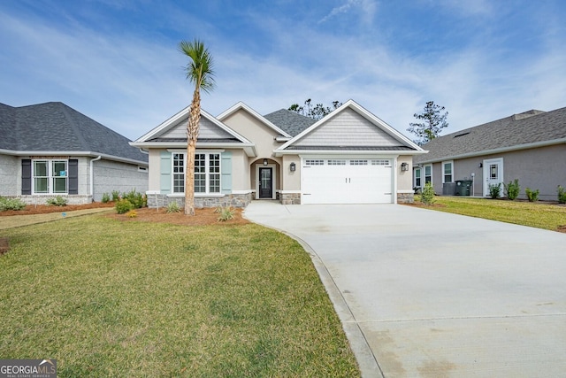 view of front of property featuring a garage and a front yard