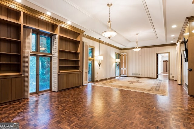 interior space with built in features, ornamental molding, and dark parquet floors