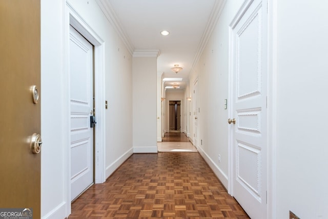 hall featuring dark parquet flooring and ornamental molding