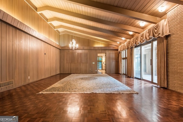 entryway with wooden walls, dark parquet floors, an inviting chandelier, beam ceiling, and wood ceiling