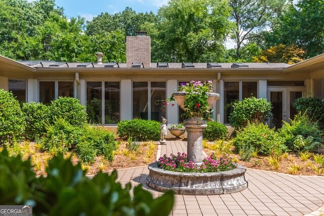 back of property featuring a patio