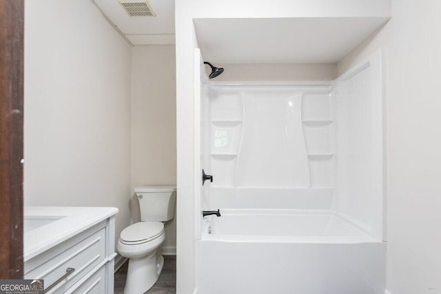 full bathroom featuring vanity, toilet, shower / tub combination, and hardwood / wood-style floors