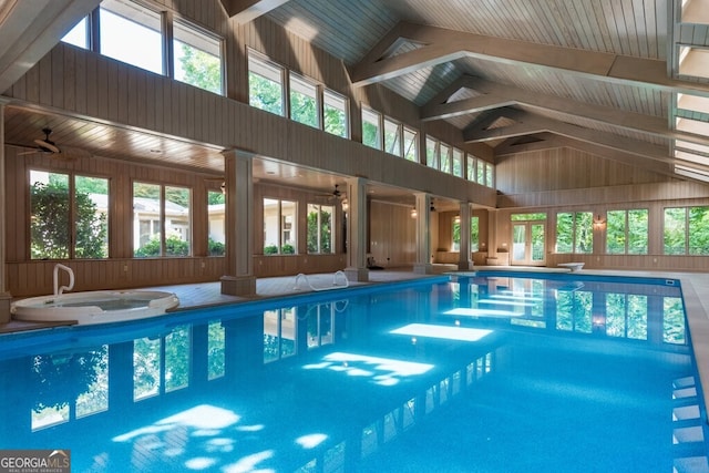 view of swimming pool with an indoor hot tub and ceiling fan