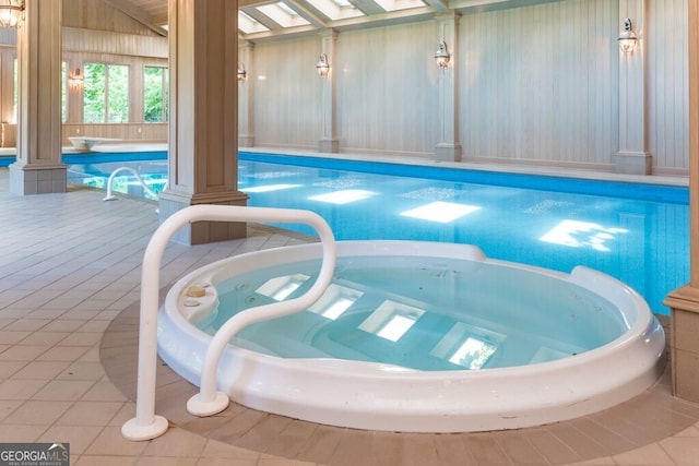 view of swimming pool featuring an indoor in ground hot tub