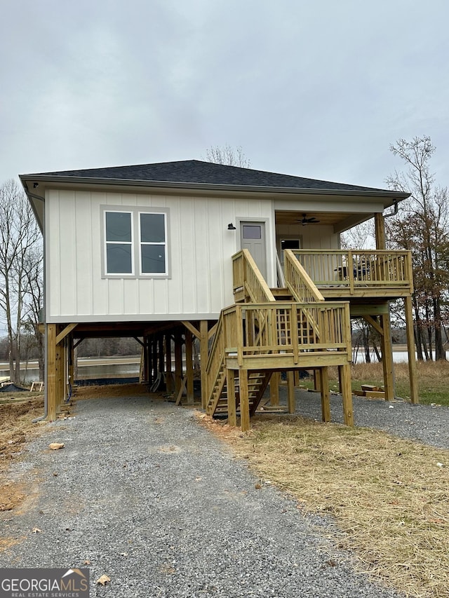 view of front of home featuring a carport and ceiling fan