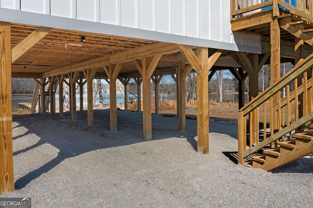 view of patio featuring a carport and a water view