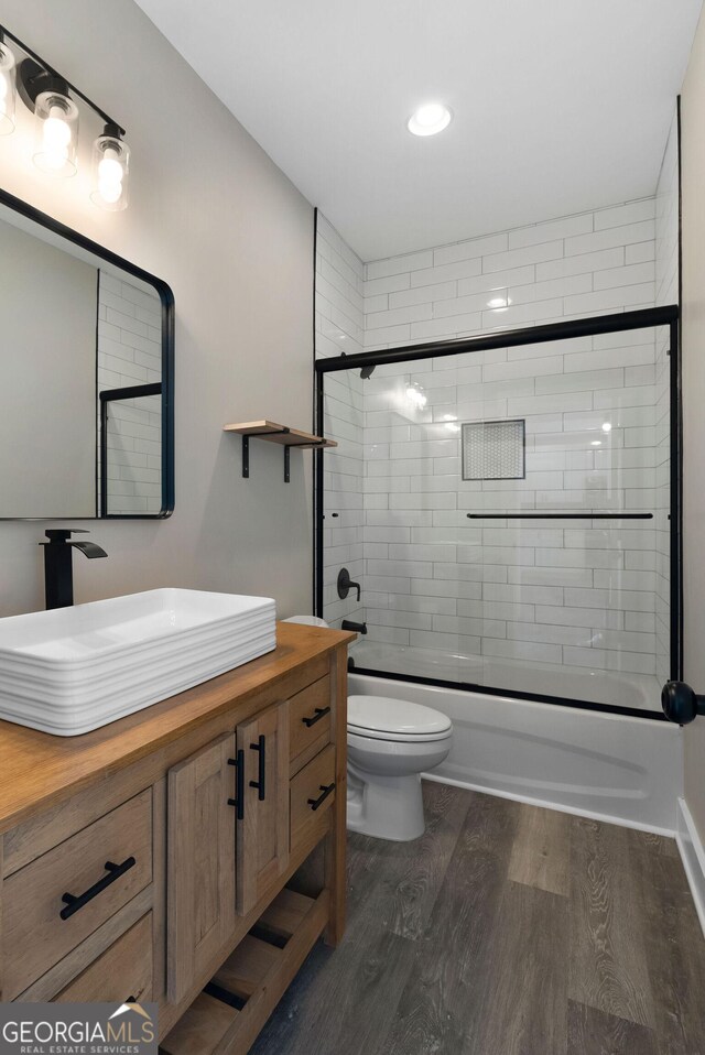 laundry area featuring washer hookup and dark hardwood / wood-style flooring